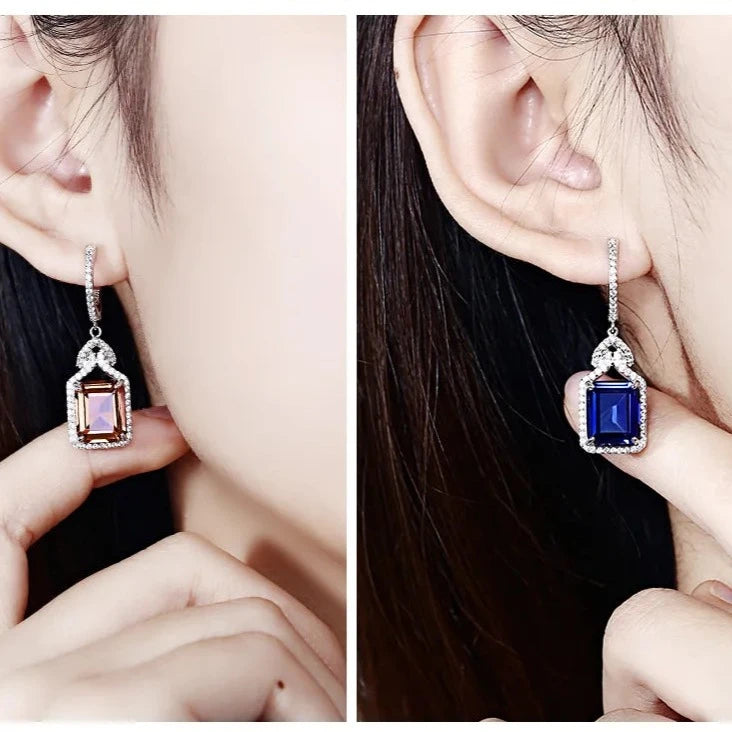 925 Silver 12 CT Created Zultanite Charming Style Drop Earrings - zultanite and blue sapphire earrings on model