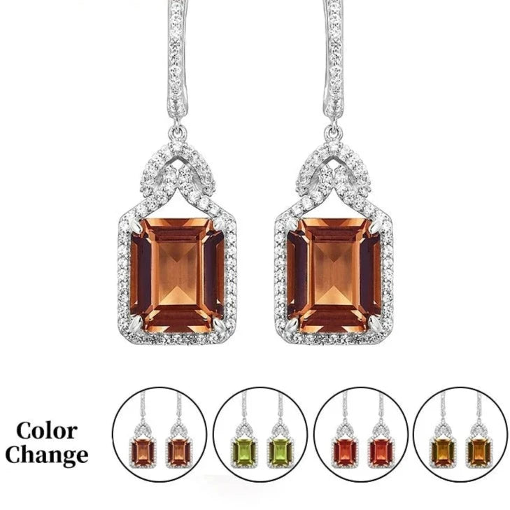 Silver 12 CT Created Zultanite Charming Style Drop Earrings - comparing color changes in zultanite gemstone